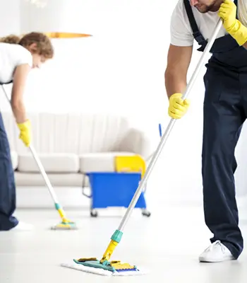 Cleaner cleaning reception area of a building in West Midlands